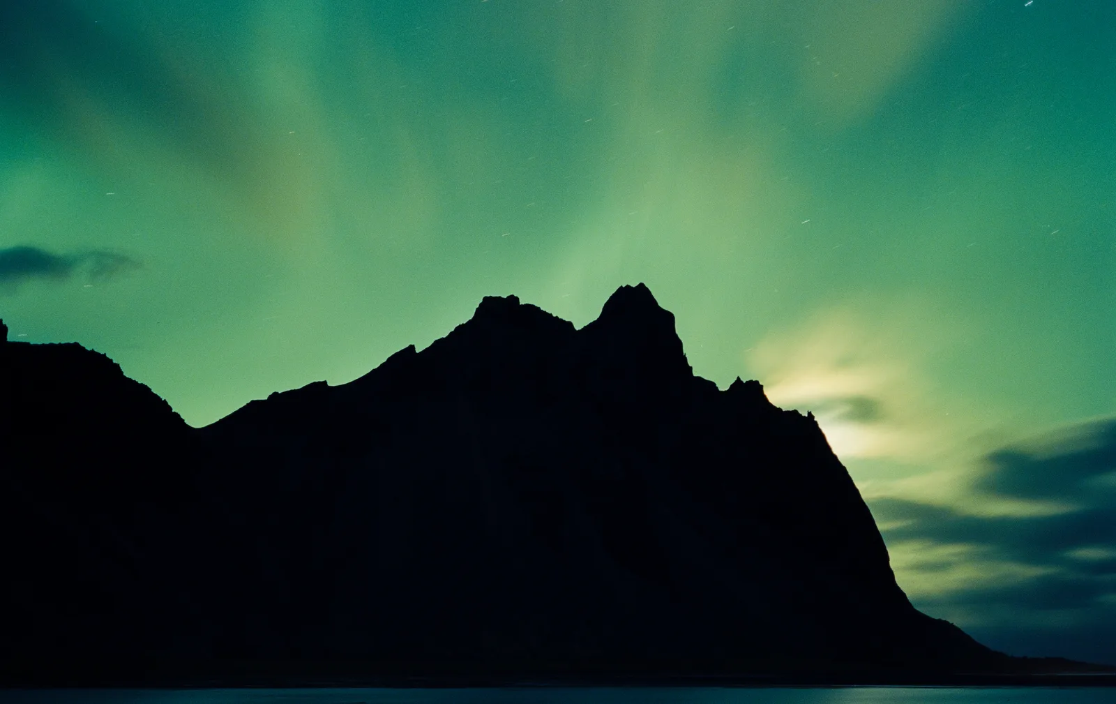 Stokksnes covered by Aurora Borealis